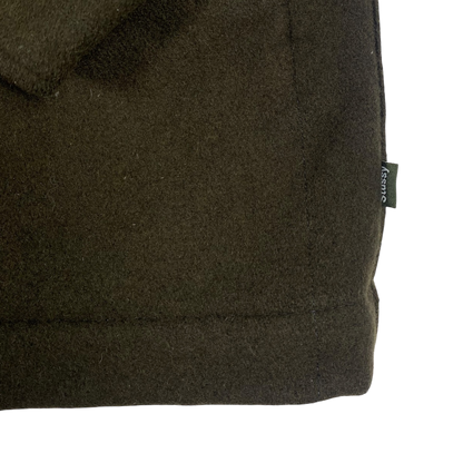 olive green Stüssy jacket features a dark brown corduroy collar