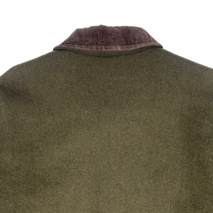 olive green Stüssy jacket features a dark brown corduroy collar
