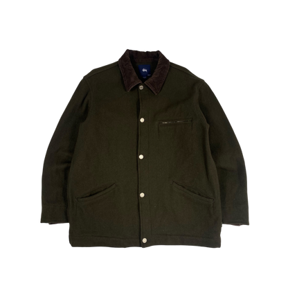 olive green Stüssy jacket features a dark brown corduroy collar