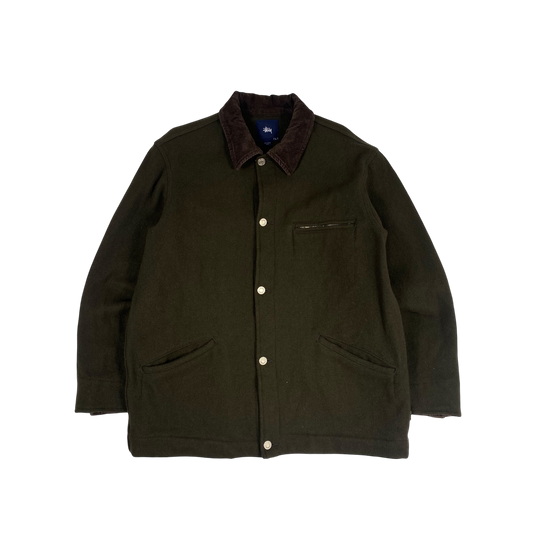 olive green Stüssy jacket features a dark brown corduroy collar